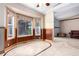 Eat-in dining nook with decorative windows and trim and tile flooring with views to living room at 1015 S Fulton Ave, Fort Lupton, CO 80621
