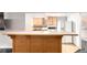 Basement kitchen features bar seating and full-sized appliances at 1015 S Fulton Ave, Fort Lupton, CO 80621