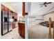 Open concept living room with adjacent kitchen and sliding door to backyard, perfect for entertaining at 1015 S Fulton Ave, Fort Lupton, CO 80621