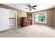 Spacious bedroom with a large window, ceiling fan, and neutral walls providing plenty of natural light at 1015 S Fulton Ave, Fort Lupton, CO 80621