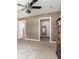 Spacious bedroom showcasing three entrances, a ceiling fan and neutral walls and carpet at 1015 S Fulton Ave, Fort Lupton, CO 80621