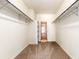 Spacious walk-in closet with shelves and clothing rods providing ample storage space at 1015 S Fulton Ave, Fort Lupton, CO 80621