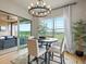 Cozy dining area with a round table, scenic view, and natural light creating an inviting ambiance at 2113 Fountain Cir, Erie, CO 80516