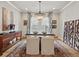 Elegant dining room boasting a modern chandelier, artful decor, and stylish furnishings at 2113 Fountain Cir, Erie, CO 80516