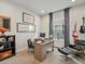Comfortable home office with modern desk, decor, and window providing plenty of light at 2113 Fountain Cir, Erie, CO 80516