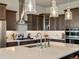 This modern kitchen features stainless appliances, a large island with a sink, and plenty of storage space at 2113 Fountain Cir, Erie, CO 80516