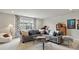 Comfortable living room showcasing a large sectional sofa and stylish decor at 2113 Fountain Cir, Erie, CO 80516