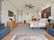 Spacious primary bedroom featuring a ceiling fan, wood floors, and ample natural light at 2113 Fountain Cir, Erie, CO 80516