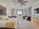 Spacious main bedroom with plush seating area, large windows, and ample natural light at 2113 Fountain Cir, Erie, CO 80516