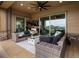 Outdoor patio featuring lounge seating and views through sliding glass doors at 2113 Fountain Cir, Erie, CO 80516