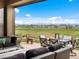 Outdoor patio featuring lounge seating, dining table, and mountain views at 2113 Fountain Cir, Erie, CO 80516