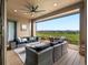 Spacious outdoor patio with lounge seating, table and mountain views at 2113 Fountain Cir, Erie, CO 80516