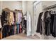 Walk-in closet with organized shelving and hanging racks for efficient storage at 2113 Fountain Cir, Erie, CO 80516