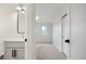 Simple bathroom with a floating vanity and a window at 1601 Yates St, Denver, CO 80204