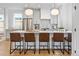 Modern kitchen with island, stainless steel appliances, and white cabinets at 1601 Yates St, Denver, CO 80204