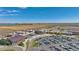 Wide aerial shot featuring a school with sports fields and parking lots at 4206 Sandstone Dr, Mead, CO 80504