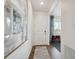 Bright entryway with hardwood floors, a white door, and neutral decor at 4206 Sandstone Dr, Mead, CO 80504