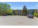 Exterior view of the building with parking and landscaping in front at 13626 E Bates Ave # 110, Aurora, CO 80014