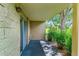 Charming covered patio area with ample sunlight, offering a peaceful retreat with views of manicured landscaping at 13626 E Bates Ave # 110, Aurora, CO 80014