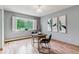 Cozy dining area with a round table, chairs, and a view of the outdoor landscape at 13626 E Bates Ave # 110, Aurora, CO 80014