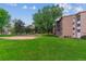 Well maintained lawn on a beautiful day featuring well maintained building exterior at 13626 E Bates Ave # 110, Aurora, CO 80014