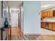 Entryway hallway with wood floors leading to the kitchen at 13626 E Bates Ave # 110, Aurora, CO 80014