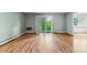 Bright living room with hardwood floors and sliding glass doors opening to a patio area at 13626 E Bates Ave # 110, Aurora, CO 80014