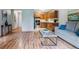Cozy living room adjacent to kitchen with views and natural light at 13626 E Bates Ave # 110, Aurora, CO 80014
