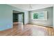 Open-concept living space with large window and sliding glass doors at 13626 E Bates Ave # 110, Aurora, CO 80014