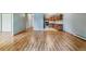Spacious living room with wood flooring that flows into the adjacent kitchen at 13626 E Bates Ave # 110, Aurora, CO 80014