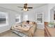 Bright bedroom with multiple windows, ceiling fan, and comfortable decor at 6631 E 78Th Avenue Ave, Commerce City, CO 80022