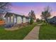 Charming single-story home with blue siding, brick accents, and a well-maintained lawn at 6631 E 78Th Avenue Ave, Commerce City, CO 80022