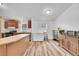 Kitchen area with wood cabinets, modern appliances, and updated flooring at 6631 E 78Th Avenue Ave, Commerce City, CO 80022