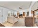 Spacious living room with large windows, neutral carpeting, and ample seating area at 6631 E 78Th Avenue Ave, Commerce City, CO 80022