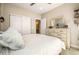 Bright bedroom with double doors to closet and ensuite bathroom at 11291 Star Streak Rd, Littleton, CO 80125