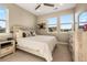 Cozy bedroom with light wood furniture and plenty of natural light at 11291 Star Streak Rd, Littleton, CO 80125