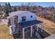 Aerial view of home featuring a large deck and well-manicured lawn at 13577 W Alaska Dr, Lakewood, CO 80228