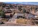 Expansive aerial view showcasing the home's location, surrounding neighborhood, and mountain views at 13577 W Alaska Dr, Lakewood, CO 80228