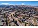 An aerial view shows the home's location in a neighborhood with mountain views at 13577 W Alaska Dr, Lakewood, CO 80228