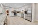 Bright kitchen with stainless steel appliances and stone countertops in an open layout at 13577 W Alaska Dr, Lakewood, CO 80228