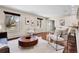 Bright living room with hardwood floors, modern decor, and large windows for plenty of natural light at 13577 W Alaska Dr, Lakewood, CO 80228