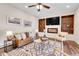 Stylish living room featuring a media center and plush comfortable seating at 13577 W Alaska Dr, Lakewood, CO 80228