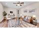 Cozy living room filled with modern decor, area rug, and comfortable furniture at 13577 W Alaska Dr, Lakewood, CO 80228
