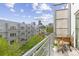 Private balcony overlooking community green space and a view of the city skyline at 2550 Lawrence St # Rb306, Denver, CO 80205