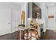 Modern kitchen boasts stainless steel appliances, sleek cabinetry, breakfast bar, and hardwood floors at 2550 Lawrence St # Rb306, Denver, CO 80205