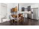 Bright kitchen and desk area with stainless steel appliances, modern cabinetry, and hardwood floors at 2550 Lawrence St # Rb306, Denver, CO 80205