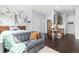 Modern apartment showcasing an open layout with stylish furnishings and a unique ski lift mural accent wall at 2550 Lawrence St # Rb306, Denver, CO 80205