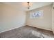 Bright bedroom with neutral walls and carpet flooring, complemented by a window at 3597 S Joplin St, Aurora, CO 80013