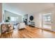 Spacious living room with a stone fireplace, vaulted ceiling, and sliding glass doors, perfect for relaxation at 3597 S Joplin St, Aurora, CO 80013