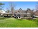 Expansive backyard featuring multiple seating areas and lush landscaping, perfect for outdoor gatherings at 6375 E Tufts Ave, Englewood, CO 80111